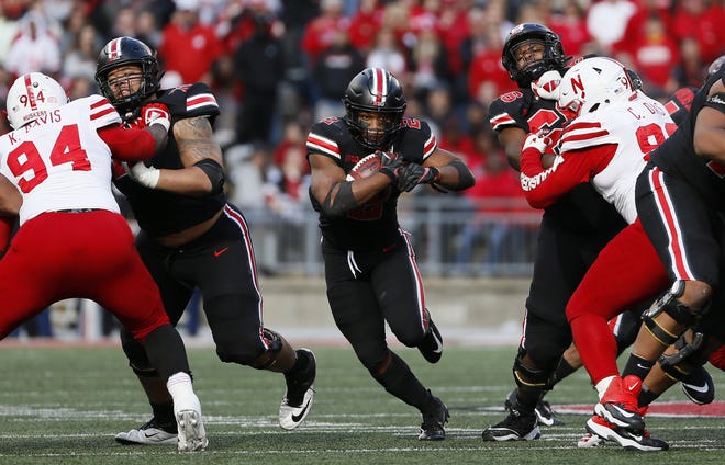 Ohio State running back J.K. Dobbins gets blocks from guards Demetrius Knox, left, and Malcolm Pridgeon on a 42-yard touchdown run against Nebraska. The Buckeyes, who rushed for 229 yards against the Cornhuskers, next face Michigan State, which leads the nation in run defense. [Adam Cairns/Dispatch]