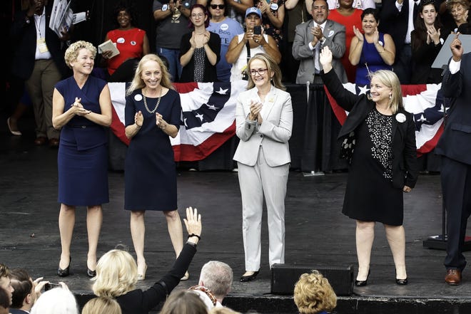 In this Sept. 21, 2018 photo, Pennsylvania congressional candidates, from left, Chrissy Houlahan, Mary Gay Scanlon, state Rep. Madeleine Dean and Susan Wild, take part in a campaign rally in Philadelphia. Each of the Democratic candidates won their elections on Nov. 6 and are set to become the first women from Pennsylvania to serve full terms in Congress since 2014. (AP Photo/Matt Rourke)