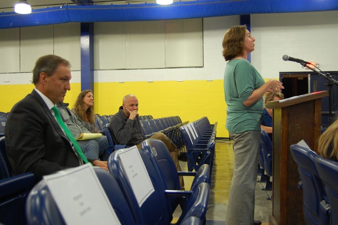 A mother speaks out on proposed middle school redistricting maps Thursday at the New Hanover County school board's first public forum on redistricting. [CAMMIE BELLAMY/STARNEWS]