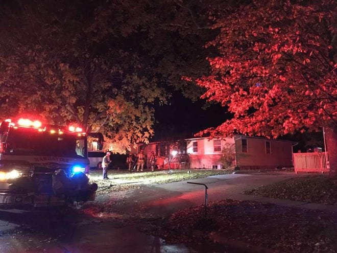 The Manhattan Fire Department announced in a news release sent out Thursday morning that the co-owner of this house in Manhattan had been arrested in connection with arson linked to a fire set there last week. [Manhattan Fire Department from Topeka Capital-Journal archives]