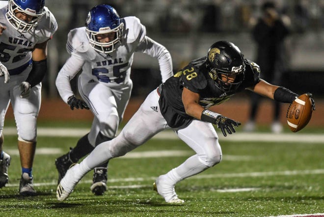 Topeka High junior Ky Thomas has rushed for a team-high 1,570 yards and scored 21 touchdowns for the 9-1 Trojans. [REX WOLF/THE CAPITAL-JOURNAL]