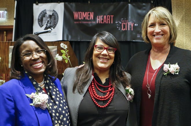 From left, Topeka USD 501 superintendent Tiffany Anderson, Topeka Mayor Michelle De La Isla, and Lisa Entz, senior vice president of World Impact Topeka, were honored Thursday for their inspirational service at the Women Who've Changed the Heart of the City luncheon at the Capitol Plaza Hotel. [Chris Neal/The Capital-Journal]