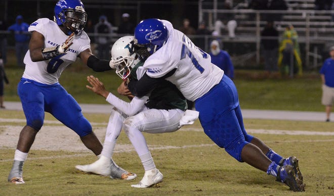 Greene Central defenders sacked Kinston quarterback Kieran Hooker in last year's NCHSAA 1st round playoff game in Kinston. The Vikings head into Snow Hill this Friday looking for revenge. [Janet Carter / The Free Press]