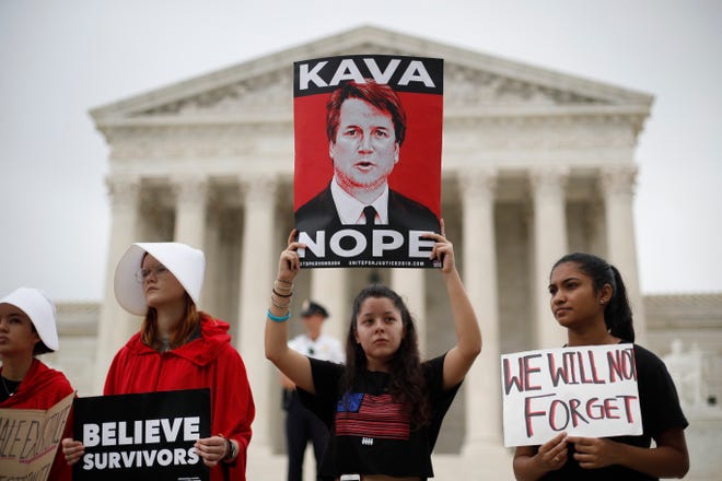 Women protest in front of the Supreme Court in Washington in October, as Justice Brett Kavanaugh took the bench. [AP, FILE]