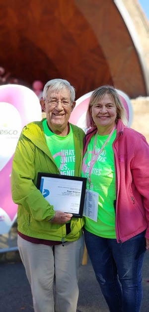 Pictured, from left: Roger Medeiros, of Braintree, recently accepted the American Cancer Society’s Sandra C. Labaree Volunteer Values Award during the Making Strides Against Breast Cancer of Boston fundraiser walk from Michele Dilley, program manager for mission delivery at the American Cancer Society. [Courtesy Photo]
