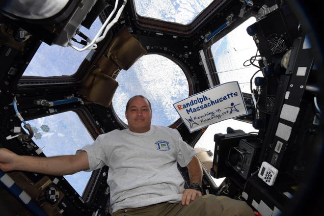 Astronaut Scott Tingle of Randolph, showing his Randolph pride in the International Space Station, will speak in Randolph on Veterans Day. [Photo courtesy/NASA]