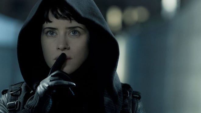 Lisbeth Salander (Claire Foy) making her way to Balder's safe house in "The Girl in the Spider's Web."