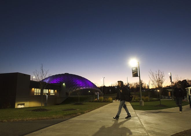It appears as if a purple moon rises in the night sky at Community College of Beaver County in Center Township. Actually, it's the CCBC Dome illuminated in purple in recognition of March of Dimes Prematurity Awareness Month. Purple is the official color of March of Dimes. [Sally Maxson/BCT staff]