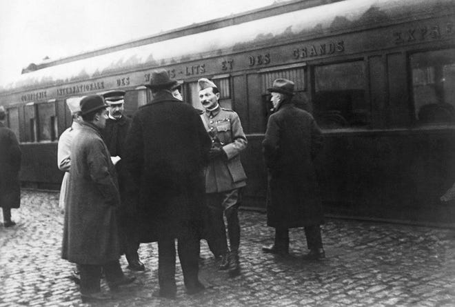 The German and French delegations speak as they wait in Rethondes for the start of the train to the Armistice conference November 1918 in the Forest of Compiegne, France. Hundreds of troops died on the final morning of World War I - even after an armistice was reached and before it came into force. Death at literally the 11th hour highlighted the futility of a conflict that had become even more incomprehensible in four years of battle. [AP file photo]