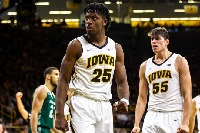 Iowa forward Tyler Cook (25) reacts after a dunk during Sunday's game against Green Bay at Carver-Hawkeye Arena in Iowa City. [Joseph Cress/Iowa City Press-Citizen via AP]