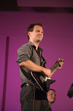 Guitarist Mark Dancigers led a New Music New College concert that featured a piece created from the sounds and information generated by falling rain. [Provided by New College of Florida / Nancy Nassiff]