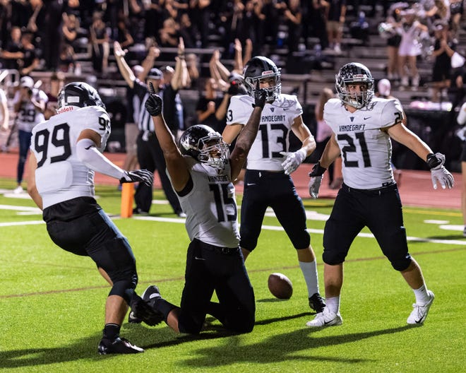 Vandegrift players celebrate after Isaiah Smallwood scores the game-winning touchdown with less than a minute remaining against Round Rock earlier this season. The unbeaten Vipers enter the playoffs as the top DII seed in District 13-6A. [Henry Huey for American-Statesman.]