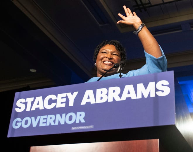 FILE - In this Nov. 6, 2018, file photo, Georgia Democratic gubernatorial candidate Stacey Abrams speaks to supporters about a suspected run-off during an election night watch party in Atlanta. For the vast majority of the nation, the 2018 midterm season is over. Yet the fight rages on in Florida and Georgia, two political battlegrounds where the strength of a Trump-era political realignment among voters by culture and class is being put to the test. Abrams hasn’t conceded her race while Andrew Gillum’s contest in Florida is undergoing a recount. (AP Photo/John Amis, File)