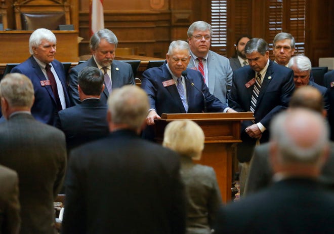 House speaker David Ralston and House members take a moment before the start of business this morning to remember State Rep. John Meadows, R-Calhoun, who was the chairman of the House Rules Committee, who died, Tuesday, Nov. 13, 2018, in Atlanta. Ralston confirmed Meadows' death and called the seven-term lawmaker "outwardly fierce and courageous but he was, at the same time, one of the kindest and most generous souls you have ever met." (Bob Andres/Atlanta Journal-Constitution via AP)