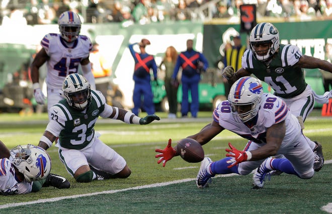 Buffalo Bills tight end Jason Croom (80) recovers a fumble by wide receiver Zay Jones , left, for a touchdown against the New York Jets during the first quarter of an NFL football game, Sunday, Nov. 11, 2018, in East Rutherford, N.J. (AP Photo/Seth Wenig)