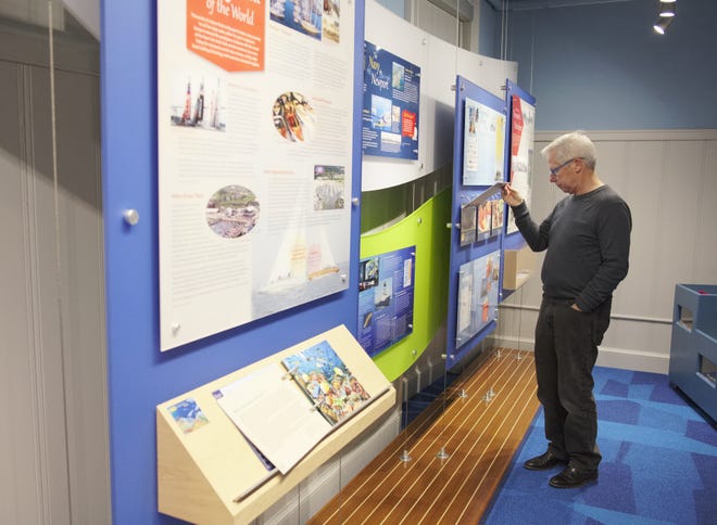 Mark Filanowski looks at one of the many displays at the interactive maritime exhibit and educational outreach program at the Seamen's Church Institute's new Discovery Deck. [PETER SILVIA PHOTO]