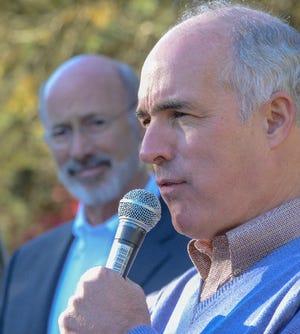 Senator Bob Casey (right) addresses the crowd as Pennsylvania Governor Tom Wolf listens while Democrats and activists hold a Get Out the Vote Rally Saturday, November 03, 2018 at RL Showalter in Chalfont. [WILLIAM THOMAS CAIN / PHOTOJOURNALIST]