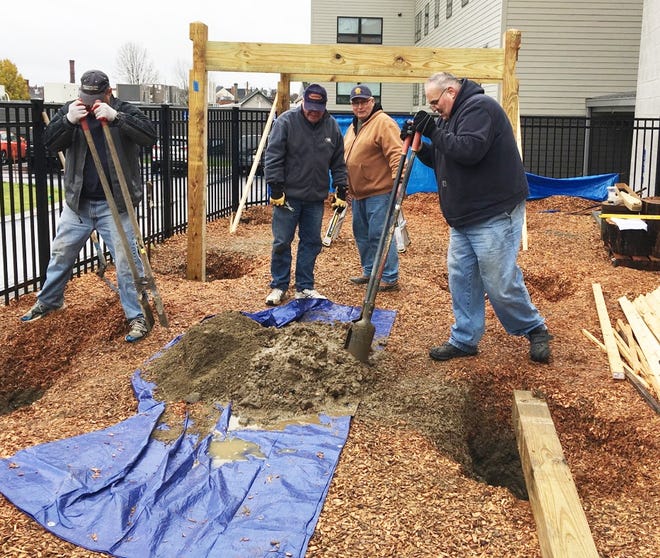 A group of Dover Rotarians volunteered to help construct Early Start/Head Start playground equipment for Community Action Partnership of Strafford County on Saturday, Nov. 10. From left are Norman Heine, Gregg Dowty, Jim Munroe and Ron Richard. Local Rotaries donated over $20,000 to fund the playground project. [Courtesy photo]