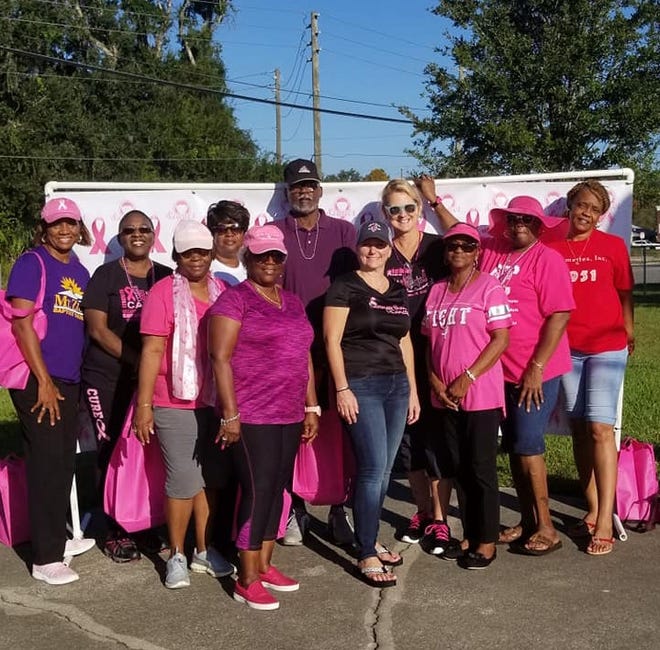 The Charmettes participate in Hastings' 5th Annual Breast Cancer Walk Oct. 20. From left: Patricia Robinson, Deborah Pelham, Rhoda Ferrell, Sonya Hughes, Evelyn Vazquez, Charmer Clarence Robinson, Wille M. Willis, Linda Wesley and Sylvia Jones. [CONTRIBUTED]