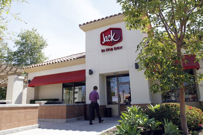 The entrance to the Jack in the Box on Campus Drive in Irvine. Jack in the Box franchisees, troubled by the financial health of the San Diego-based fast-food chain, demanded this week that they participate in corporate decisions. (Glenn Koenig/ Los Angeles Times)