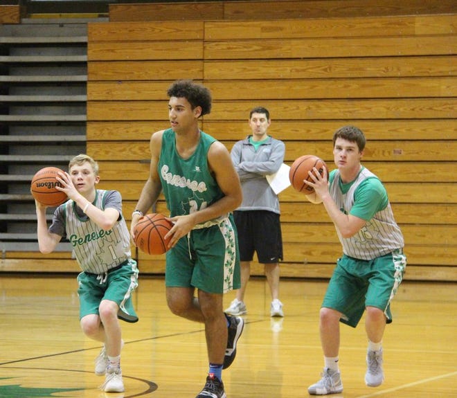 The Maple Leafs' Charlie Clauson, left, Isaiah Rivera, center, and Jacob 
McConnell run a drill to work on their footwork during Geneseo's first practice 
of the season. Geneseo will start the season with the Geneseo Central Bank Thanksgiving Tournament against Rockridge on Monday, Nov. 19 at 7 p.m.