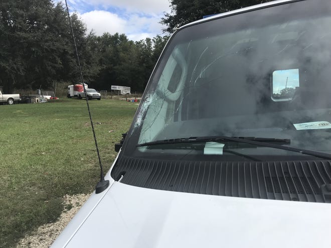 The driver of this van accidentally struck and killed a horse that wandered onto County Road 42 Thursday morning in Weirsdale. The van's windshield was damaged, but the driver was not injured. [Austin Miller/Star-Banner]