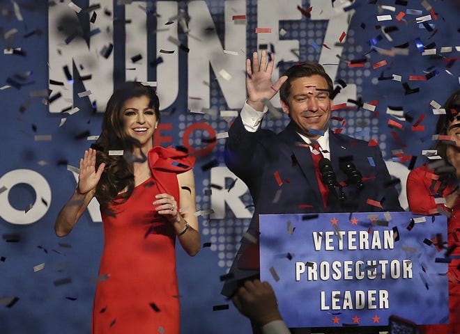Ron DeSantis and his wife, Casey, celebrate their Election Day lead in the Florida governor's race in Orlando. [Stephen M. Dowell/Orlando Sentinel via AP]