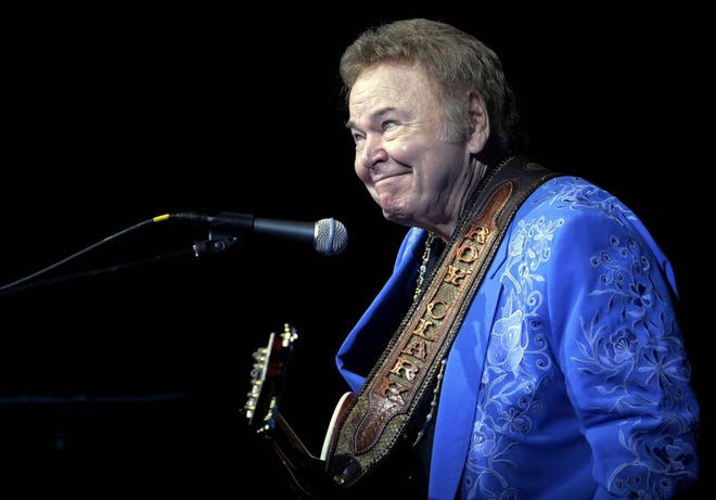 In this April 13, 2012 photo, Roy Clark smirks after joking around during his 79th birthday show at The Joint in the Hard Rock Hotel and Casino in Catoosa, Okla. Clark, the guitar virtuoso and singer who headlined the cornpone TV show "Hee Haw" for nearly a quarter century and was known for such hits as ìYesterday When I was Youngî and ìHoneymoon Feeling,î has died. He was 85. Publicist Jeremy Westby said Clark died Thursday, Nov. 15, 2018, due to complications from pneumonia at home in Tulsa, Okla. (Tulsa World via AP, File)