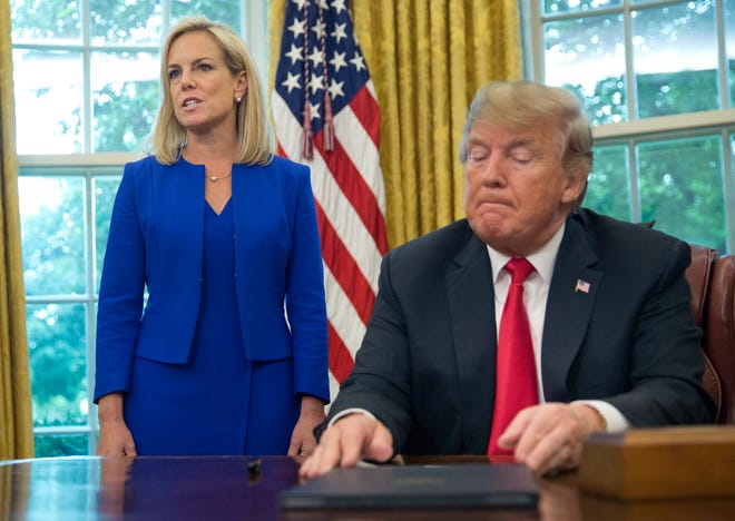 FILE - In this June 20, 2018, file photo, President Donald Trump, right, listens as Homeland Security Secretary Kirstjen Nielsen, left, addresses members of the media before Trump signs an executive order to end family separations at the border, during an event in the Oval Office of the White House in Washington. Trump and Nielsen never did quite click personally as the president chafed at her explanations of complicated immigration issues and her inability to bring about massive changes at the U.S.-Mexico border With Nielsen’s departure now considered inevitable, her eventual replacement will find there’s no getting around the immigration laws and court challenges that have thwarted the president’s hardline agenda. (AP Photo/Pablo Martinez Monsivais, File)