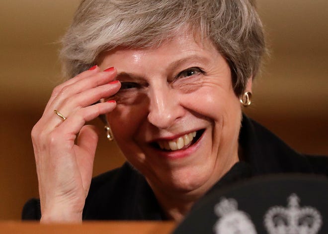 Britain's Prime Minister Theresa May reacts during a press conference inside 10 Downing Street in London, Thursday, Nov. 15, 2018. British Prime Minister Theresa May says if politicians reject her Brexit deal, it will set the country on "a path of deep and grave uncertainty." Defiant in the face of mounting criticism, May said Thursday she believed "with every fiber of my being" that the deal her government struck with the European Union was the right one. (AP Photo/Matt Dunham, Pool)