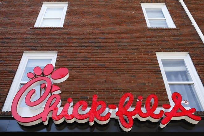 This Oct. 30, 2018, file photo, shows the Chick-fil-A sign at a restaurant in Athens, Ga. Chick-fil-A customers no longer have to go get their chicken because the chicken will come to them. The company is partnering with DoorDash to offer home delivery from more than 1,100 of its restaurants nationwide. [Joshua L. Jones/Athens Banner-Herald via AP, File]