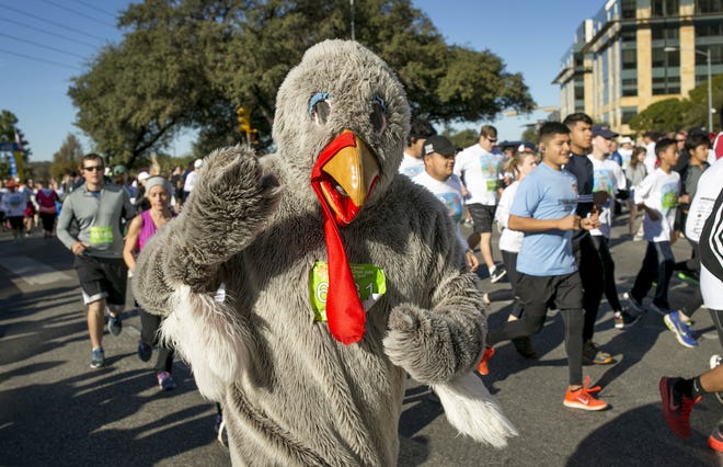 Costumes are welcome at the 28th annual ThunderCloud Subs Turkey Trot. [Jay Janner / AMERICAN-STATESMAN]