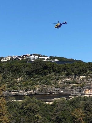 A woman was hospitalized with serious injuries on Friday after falling 80 feet from a cliff near the Pennybacker Bridge, Austin-Travis County EMS officials said. [AUSTIN-TRAVIS COUNTY EMS]