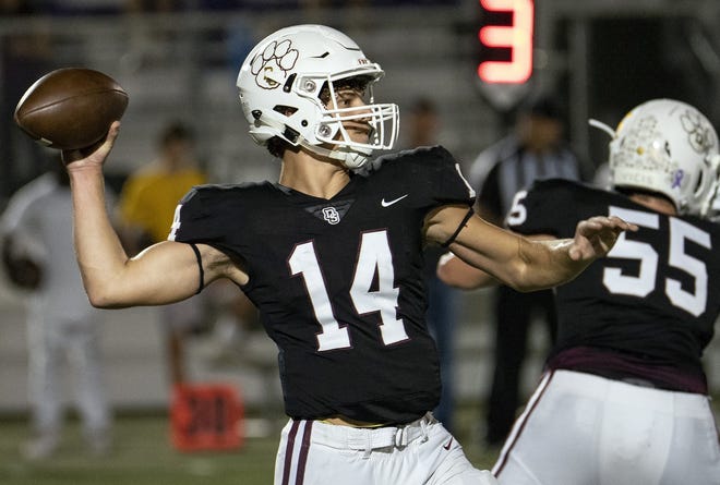 Dripping Springs (14) Tanner Prewit throws downfield against LBJ in the first half of action in District 12-5A Division I high school football held at Tiger Stadium in Dripping Springs, Texas, Friday Oct. 12, 2018. [Rodolfo Gonzalez for AMERICAN-SATESMAN]