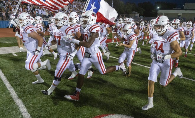 Lake Travis takes the field during a District 25-6A football game at Westlake High School, Friday, Oct. 12, 2018. [Stephen Spillman for American-Statesman]