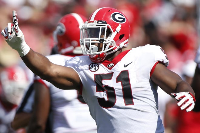Georgia defensive David Marshall celebrates during the Bulldogs' win at South Carolina earlier this season. Marshall and the Bulldogs' defensive front looks to have a big day against UMass' offensive line. [File photo/Joshua L. Jones, Athens Banner-Herald]