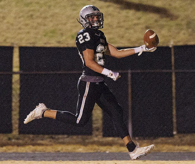 Ledford's Coleman Reich scores a touchdown on a punt return in the second quarter against Carrboro on Friday night. [Donnie Roberts/The Dispatch]