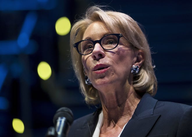 In this Sept. 17, 2018 photo, Education Secretary Betsy DeVos speaks during a student town hall at National Constitution Center in Philadelphia. DeVos is proposing a major overhaul to the way colleges handle complaints of sexual misconduct. The Education Department released a plan Friday that would require schools to investigate sexual assault and harassment only if it was reported to certain campus officials and only if it occurred on campus or other areas overseen by the school. (AP Photo/Matt Rourke)