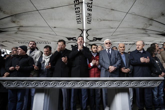 The members of Arab-Turkish Media Association and friends attend funeral prayers in absentia for Saudi writer Jamal Khashoggi who was killed last month in the Saudi Arabia consulate, in Istanbul, Friday, Nov. 16, 2018. Turkey's Foreign Minister Mevlut Cavusoglu on Thursday called for an international investigation into the killing of the Saudi dissident Jamal Khashoggi. (AP Photo/Emrah Gurel)