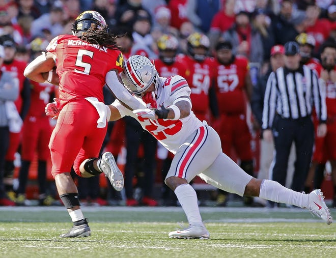 Ohio State Buckeyes safety Brendon White (25) can't bring down Maryland Terrapins running back Anthony McFarland (5) as get scores a touchdown on a long run during the 1st quarter of their game at Capital One Field at Maryland Stadium in College Park, Maryland on November 17, 2018. [Kyle Robertson/Dispatch]
