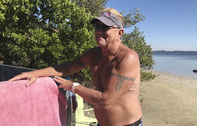 Mark Toepfer, a 58-year-old from Pinellas Park, reflects on the state's election while at the beach on Friday in St. Petersburg. Toepfer wondered why the state has so many problems counting ballots this year. [AP Photo/Tamara Lush]