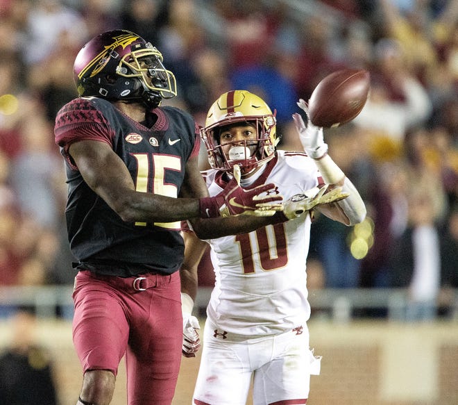 FSU's Tamorrion Terry makes a 74-yard touchdown catch in front of Boston College's Brandon Sebastian for the win late in the second half Saturday in Tallahassee. [Associated Press/Mark Wallheiser]