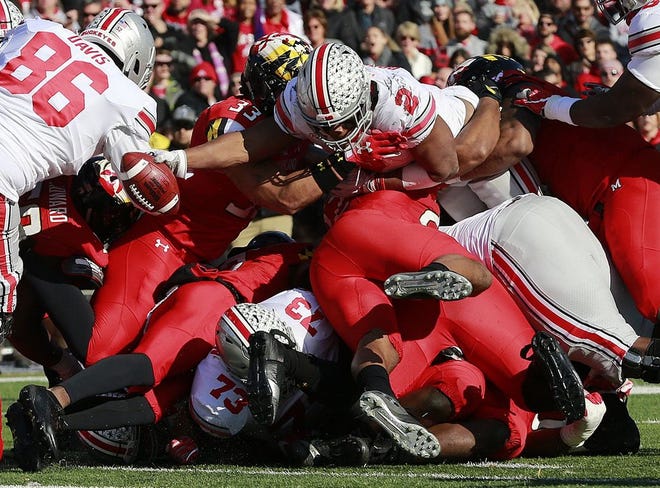 Buckeyes running back J.K. Dobbins stretches the ball over the goal line for a 1-yard touchdown late in the first half of Saturday's game against Maryland. [Photo by Brooke LaValley]