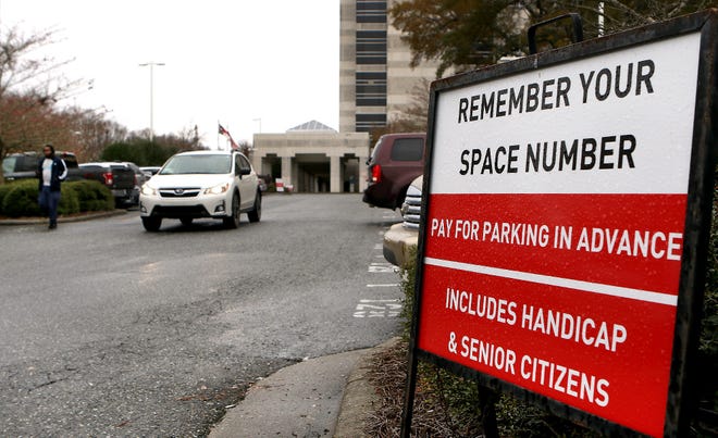 A sign in the parking lot at the Gaston County Courthouse with instructions for how to pay for parking. [JOHN CLARK/THE GASTON GAZETTE]