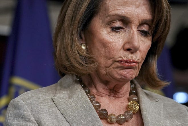 In this May 25 file photo, House Minority Leader Nancy Pelosi of Calif. pauses during a news conference on Capitol Hill in Washington. [ FILE PHOTO / AP ]
