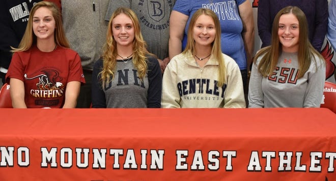 Pocono Mountain East senior field hockey players from left, Mckenzie Oprishko (Gwynedd Mercy), Jaiden Wittel (New Hampshire), Caroline Szatkowski (Bentley) and Olivia Breen (ESU) signed their letters of intent last week during the early signing period. [PHOTO PROVIDED]