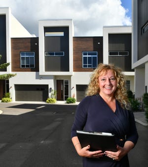 Carla Rayman-Kidd is a real estate agent who specializes in working with foreign buyers and sellers. She has listed this downtown Sarasota townhome, in the Q development, for a client from Great Britan. [Herald-Tribune staff photo / Mike Lang]