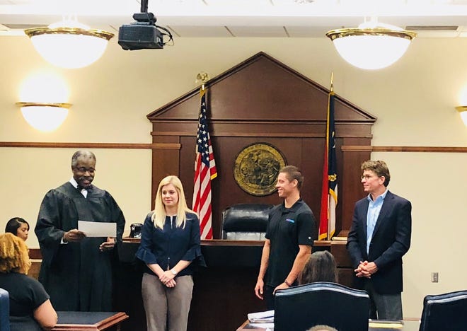 Judge James Faison (standing at left) presides over a ceremony Nov. 2 in New Hanover County Treatment Court recognizing Steve McHale as the first graduate of the Cape Fear Incentives to Exercise Program. It encourages people in addiction recovery to exercise consistently. [CONTRIBUTED PHOTO]
