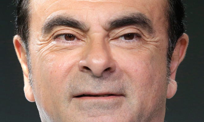 FILE - In this Feb. 16, 2016, file photo, Chairman and CEO of Renault and Nissan Motor Co.'s Carlos Ghosn poses during the presentation in Monaco. Nissan Motor Co. says an internal investigation found that its chairman Ghosn has underreported his income and will be dismissed. (AP Photo/Lionel Cironneau/File)