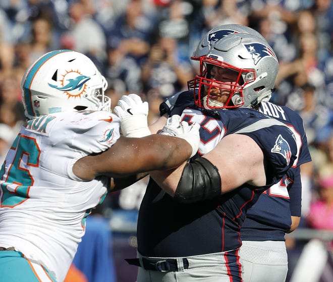 New England Patriots offensive guard Joe Thuney blocks Miami Dolphins defensive tackle Davon Godchaux during an NFL football game at Gillette Stadium, Sunday, Sept. 30, 2018 in Foxborough, Mass. (Winslow Townson/AP Images for Panini)
